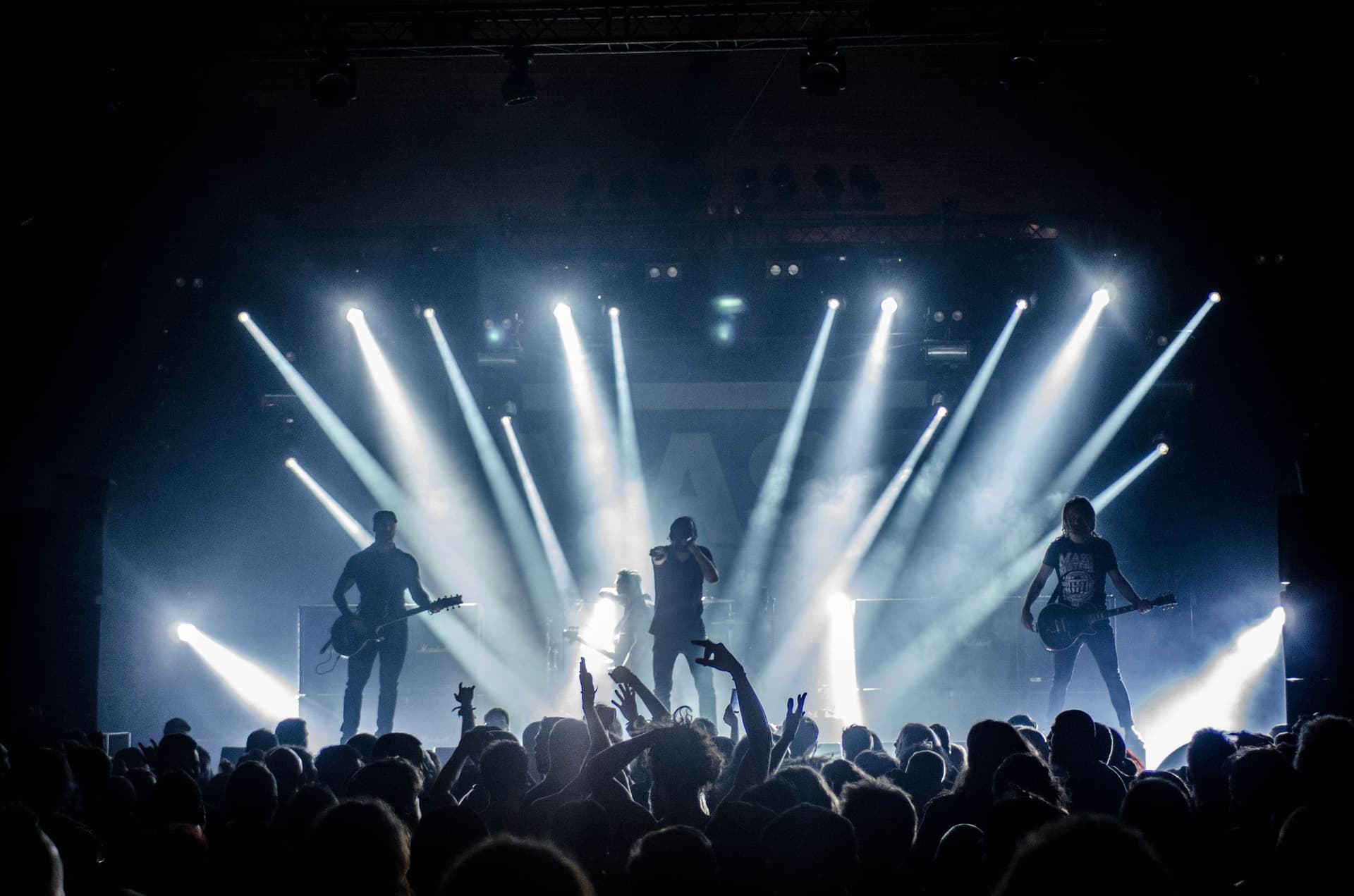 Live band performing on a darkened stage